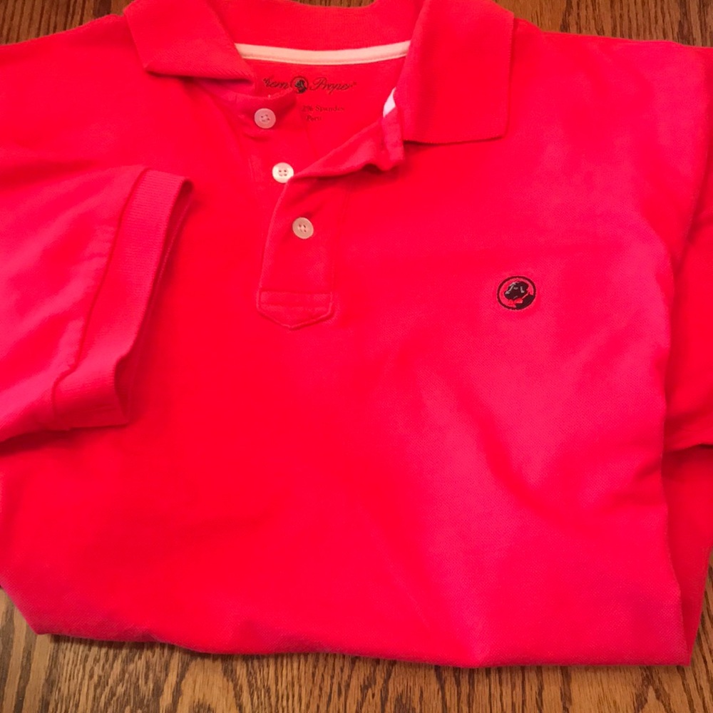 Shirt between a red and coral.. color